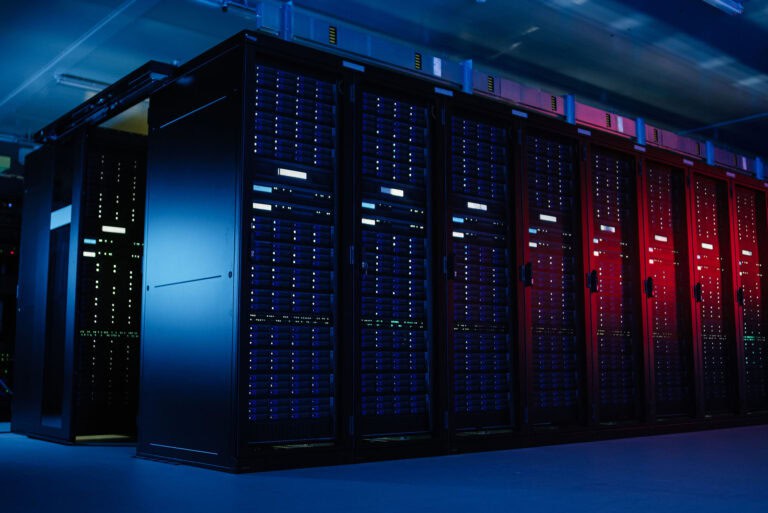 Server racks with blue and red LED lights in a data center.