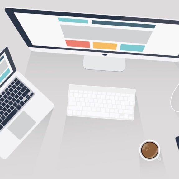 Laptops, tablet, smartphone and desktop monitor displaying digital marketing content and analytics.