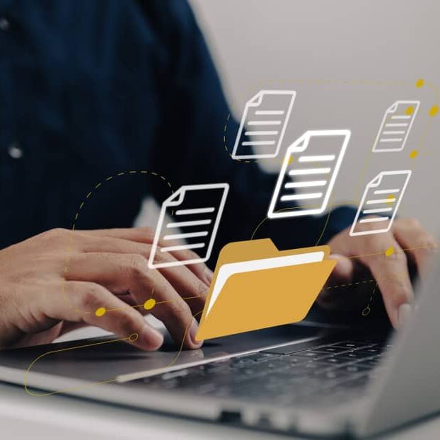 Digital file sharing on a laptop with floating document icons.