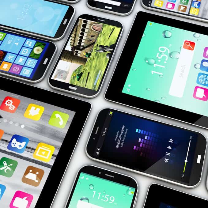 Various smartphones displaying colorful app icons and user interfaces, digital marketing and mobile technology concept.